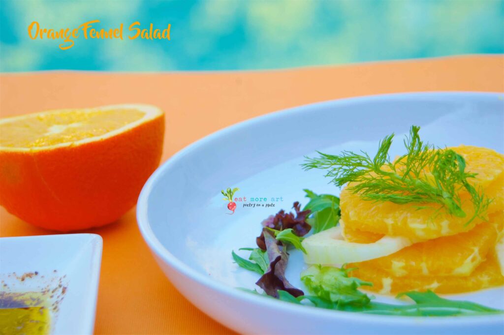 A close up shot of orange & fennel salad with greens