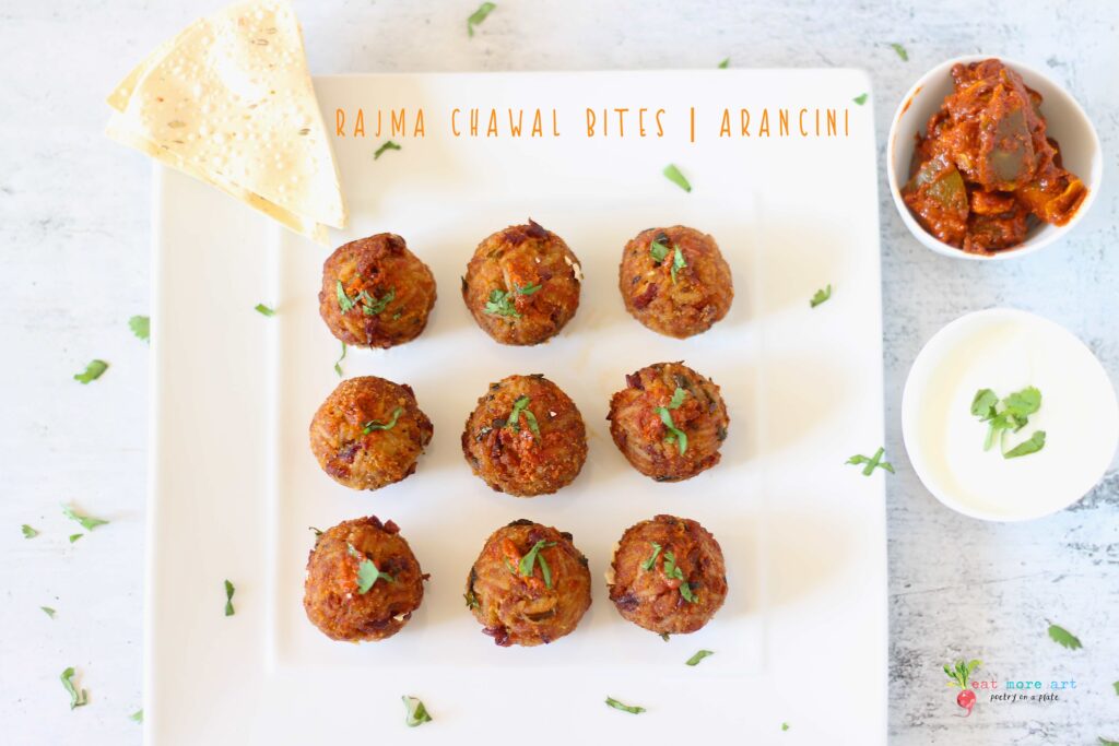 An overheard shot of Rajma Chawal ball / arancini served with yogurt, papad, pickle