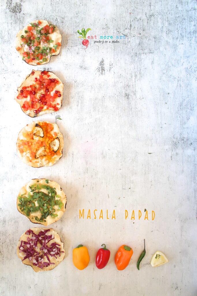 an overhead shot of masala papads topped with colorful vegetables